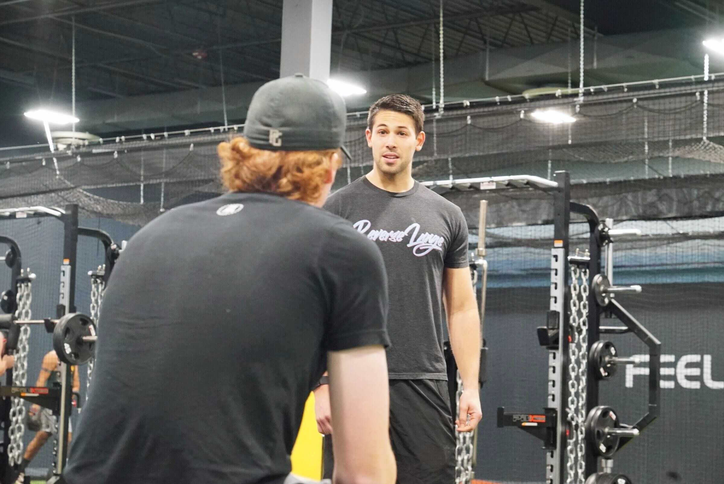 Coach and athlete on the ATP floor